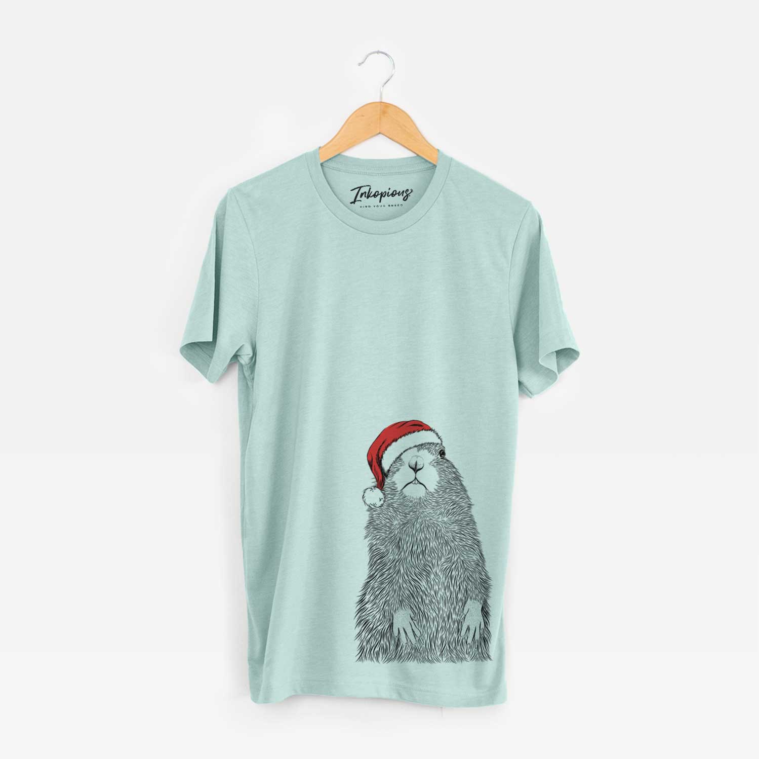 Hand-drawn sketch of Mr. Otis the Prairie Dog wearing a Santa hat on a Heather Sage Unisex crewneck