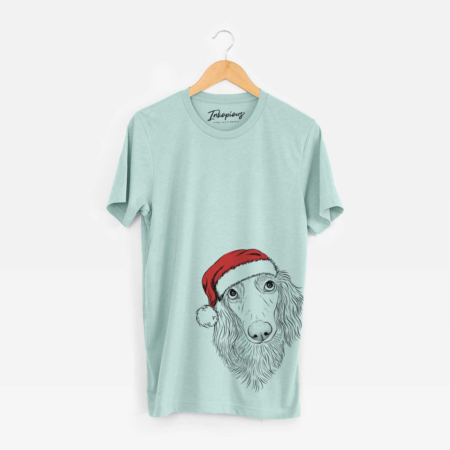 Hand-drawn sketch of Mr. Rusty the Long Haired Dachshund wearing a Santa hat on a Heather Sage Unisex crewneck