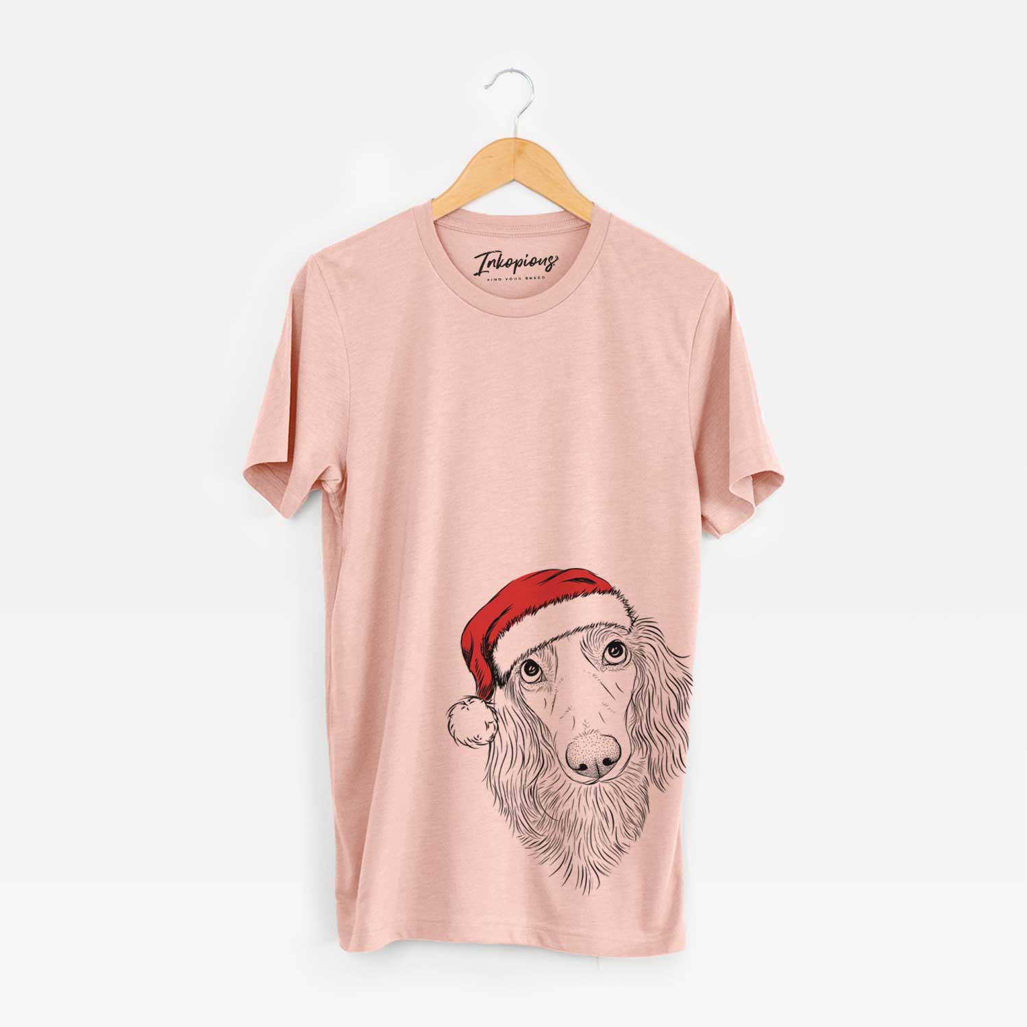 Hand-drawn sketch of Mr. Rusty the Long Haired Dachshund wearing a Santa hat on a Peach Unisex crewneck
