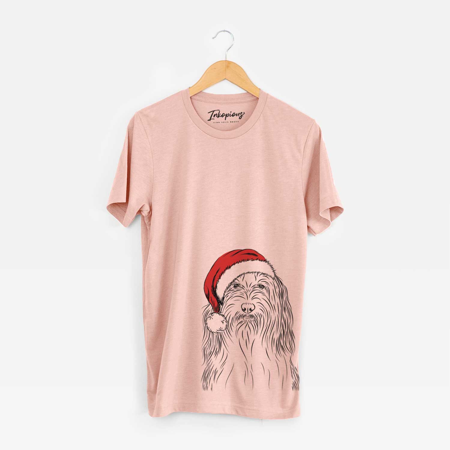 Hand-drawn sketch of Murray the Bearded Collie wearing a Santa hat on a Peach Unisex crewneck