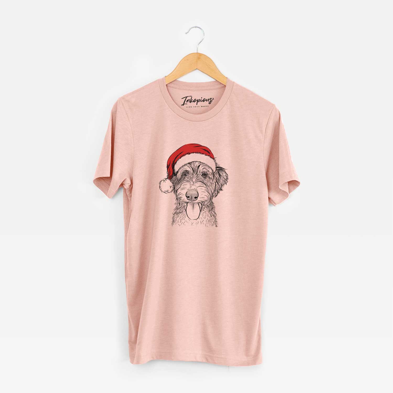 Hand-drawn sketch of Myrtle Mae the Aussiedoodle wearing a Santa hat on a Peach Unisex crewneck