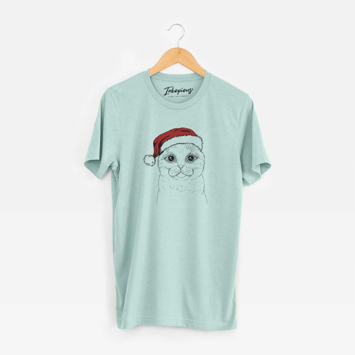 Hand-drawn sketch of Neko the Scottish Fold Cat wearing a Santa hat on a Heather Sage Unisex crewneck