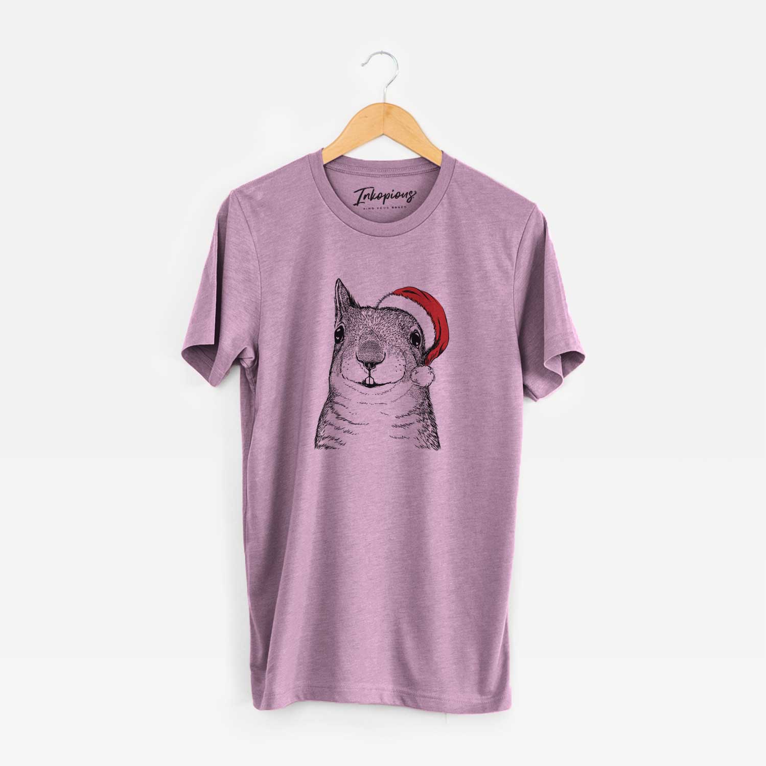 Hand-drawn sketch of Nibbles the Squirrel wearing a Santa hat on an Orchid Unisex crewneck