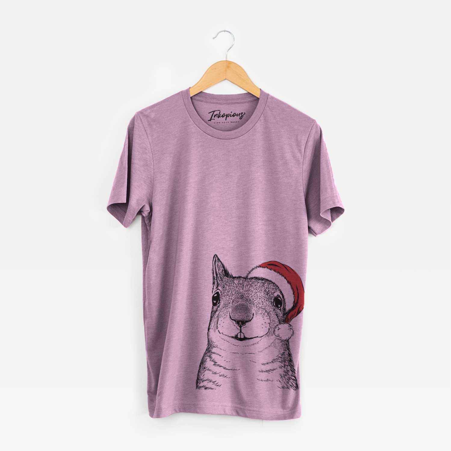 Hand-drawn sketch of Nibbles the Squirrel wearing a Santa hat on an Orchid Unisex crewneck