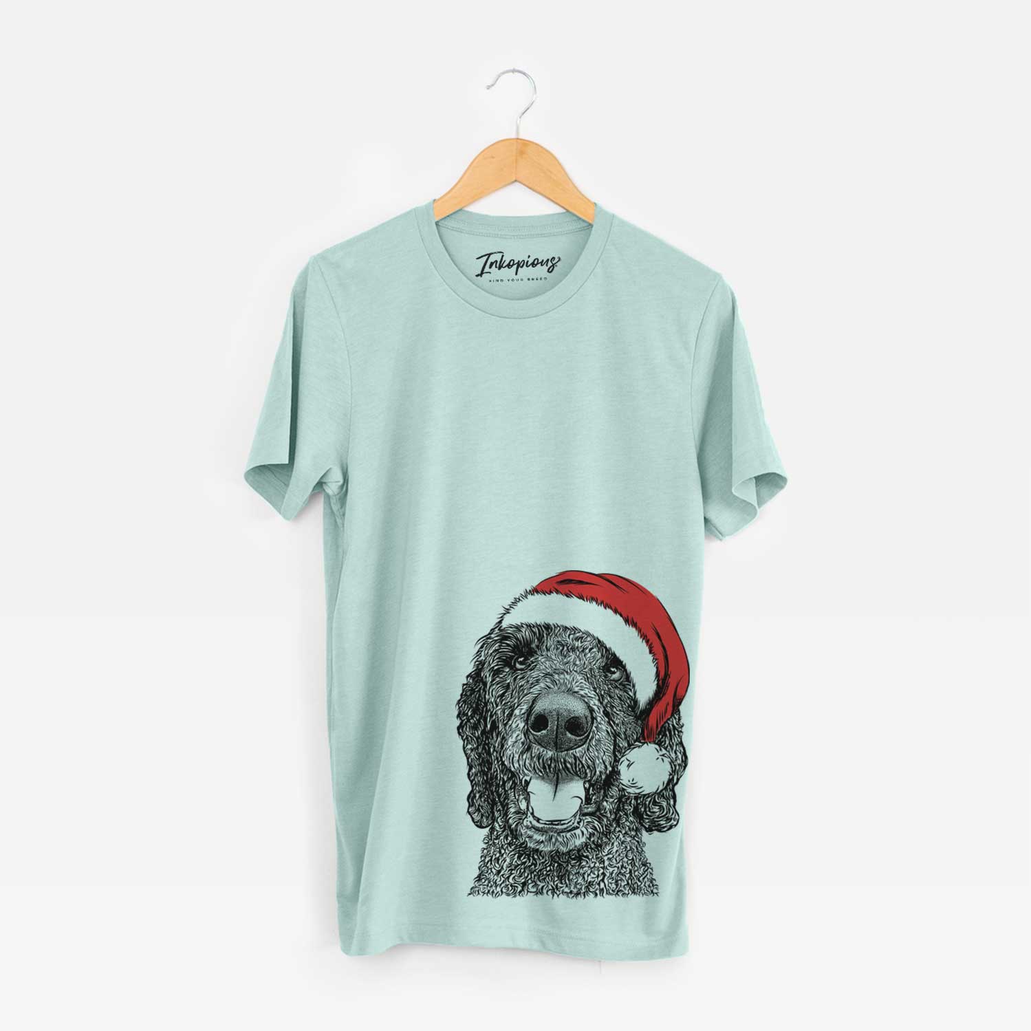 Hand-drawn sketch of Obi James the Goldendoodle wearing a Santa hat on a Heather Sage Unisex crewneck