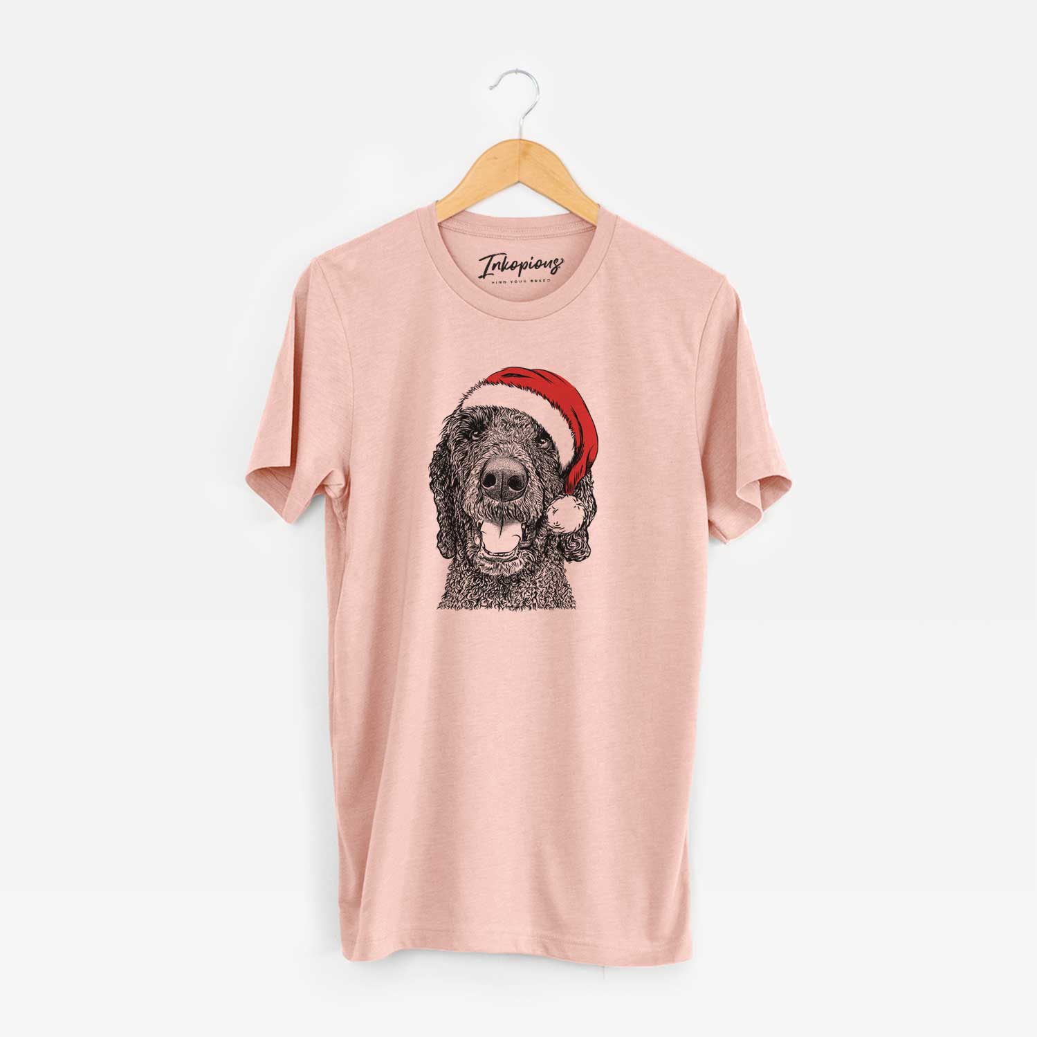 Hand-drawn sketch of Obi James the Goldendoodle wearing a Santa hat on a Peach Unisex crewneck