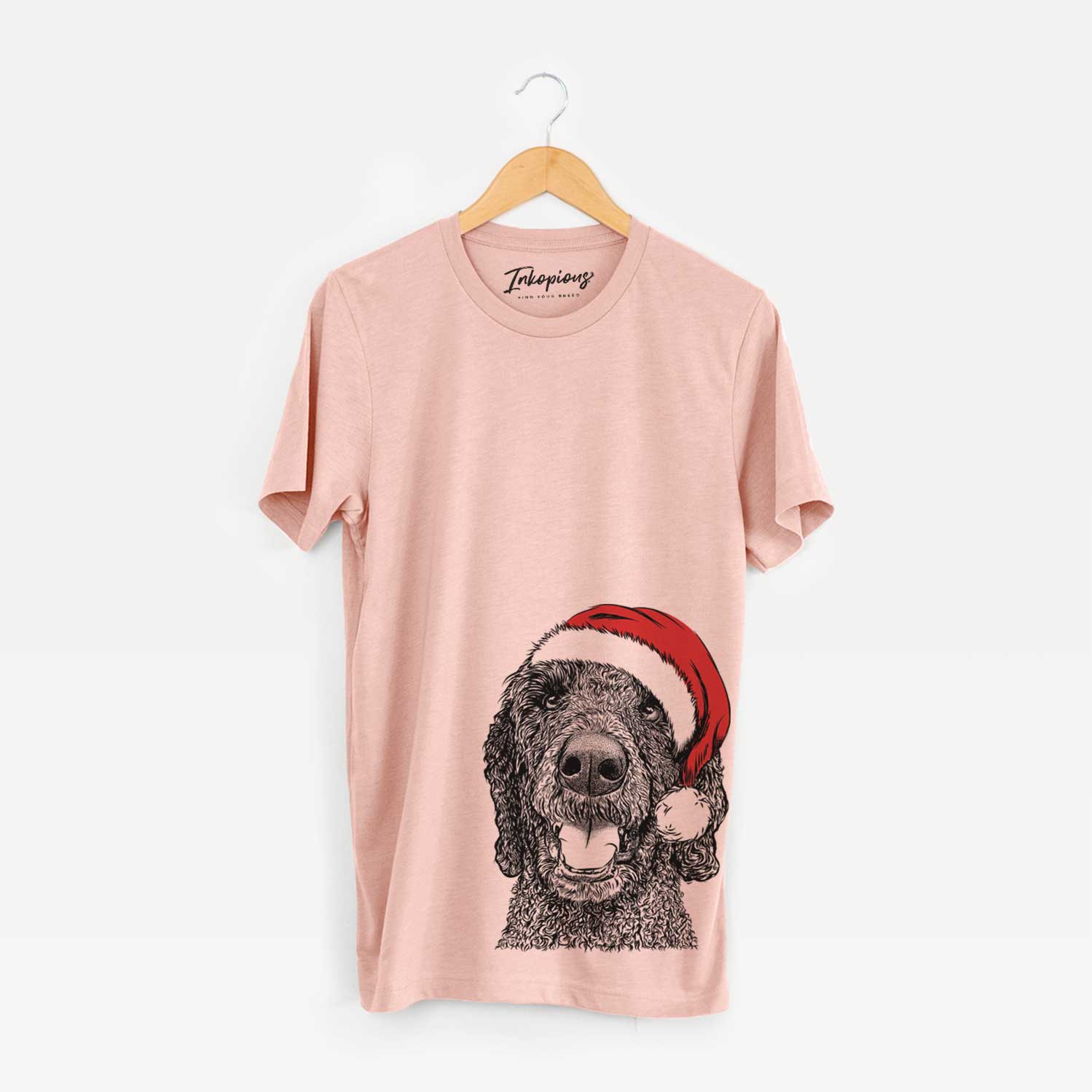 Hand-drawn sketch of Obi James the Goldendoodle wearing a Santa hat on a Peach Unisex crewneck