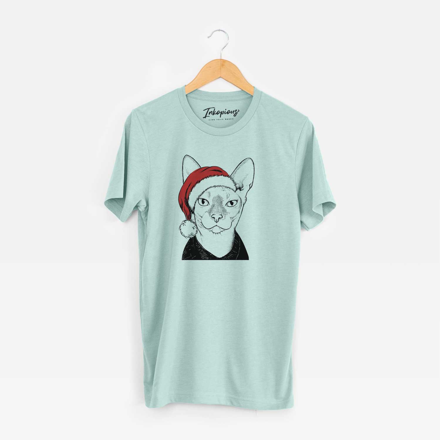 Hand-drawn sketch of Oliver Watson the Sphynx Cat wearing a Santa hat on a Heather Sage Unisex crewneck