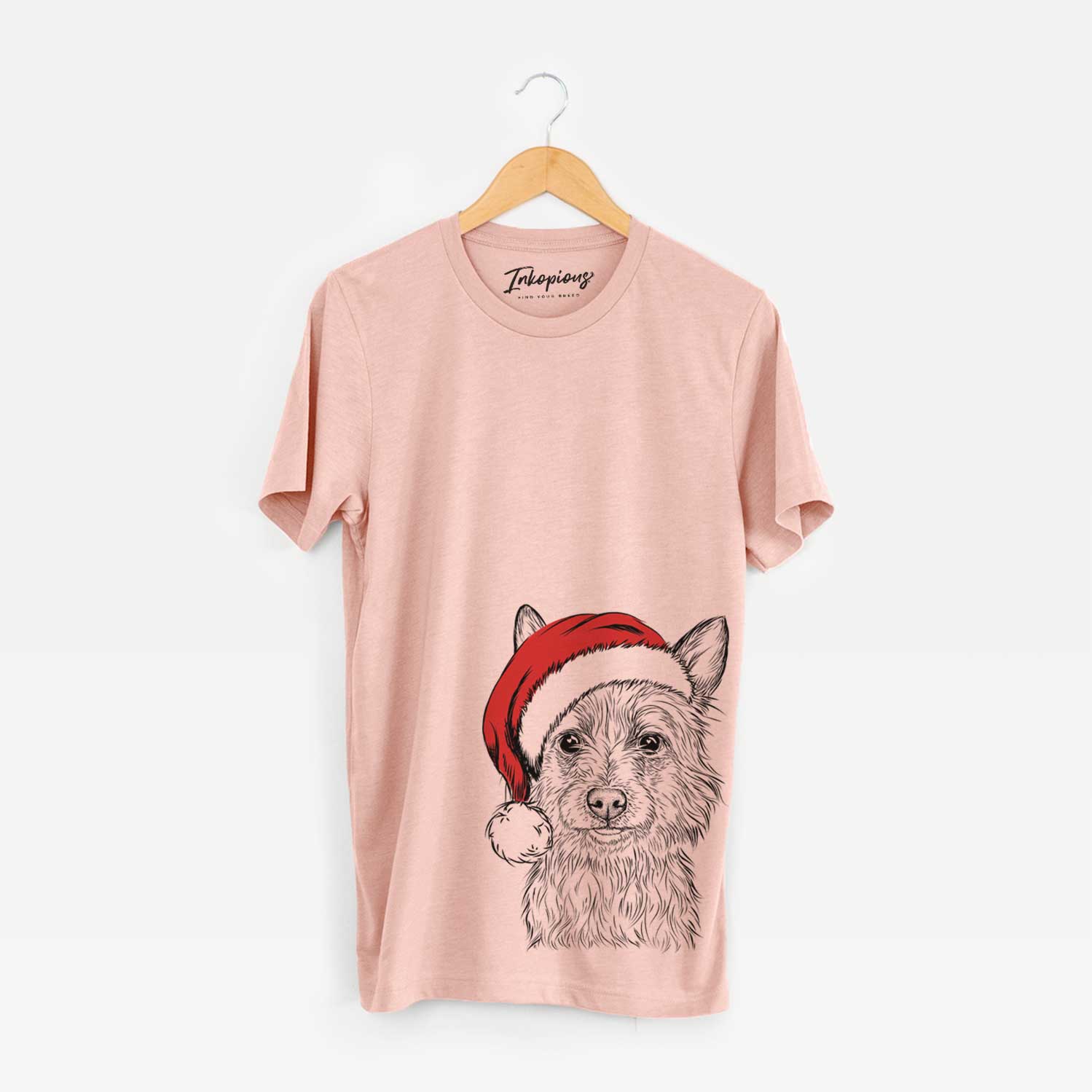 Hand-drawn sketch of Paulo the Portuguese Podengo wearing a Santa hat on a Peach Unisex crewneck