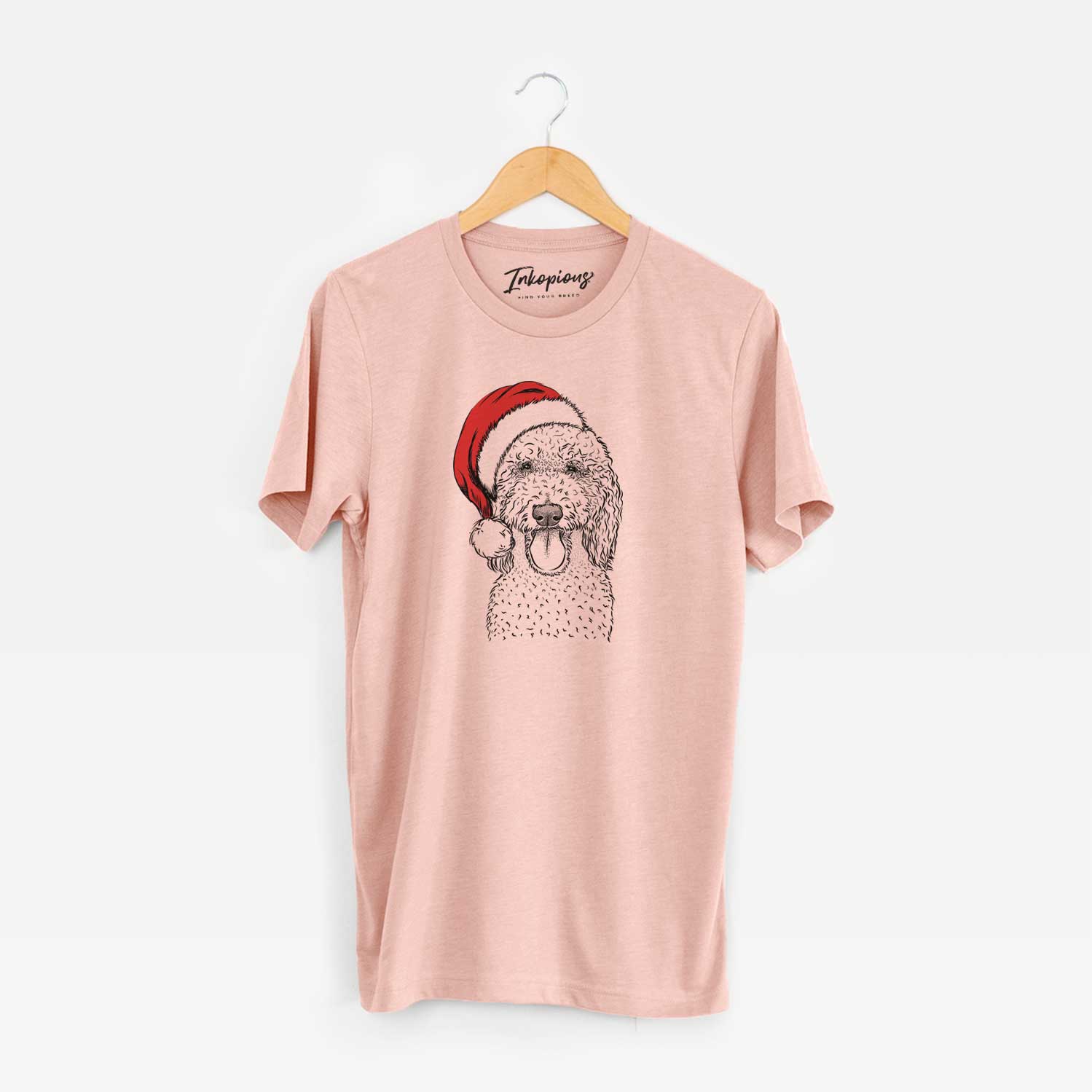 Hand-drawn sketch of Pavlov the Goldendoodle wearing a Santa hat on a Peach Unisex crewneck