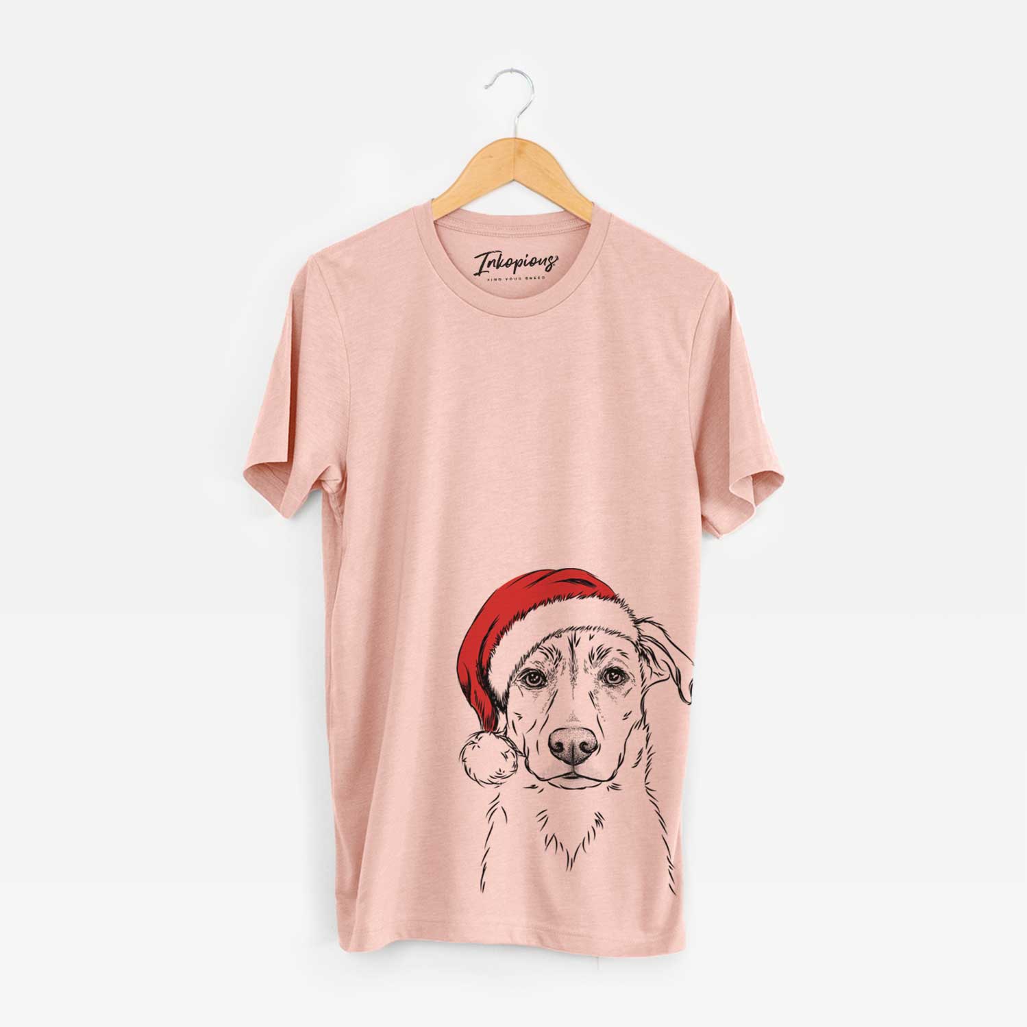 Hand-drawn sketch of Peanut the Lab Mix wearing a Santa hat on a Peach Unisex crewneck