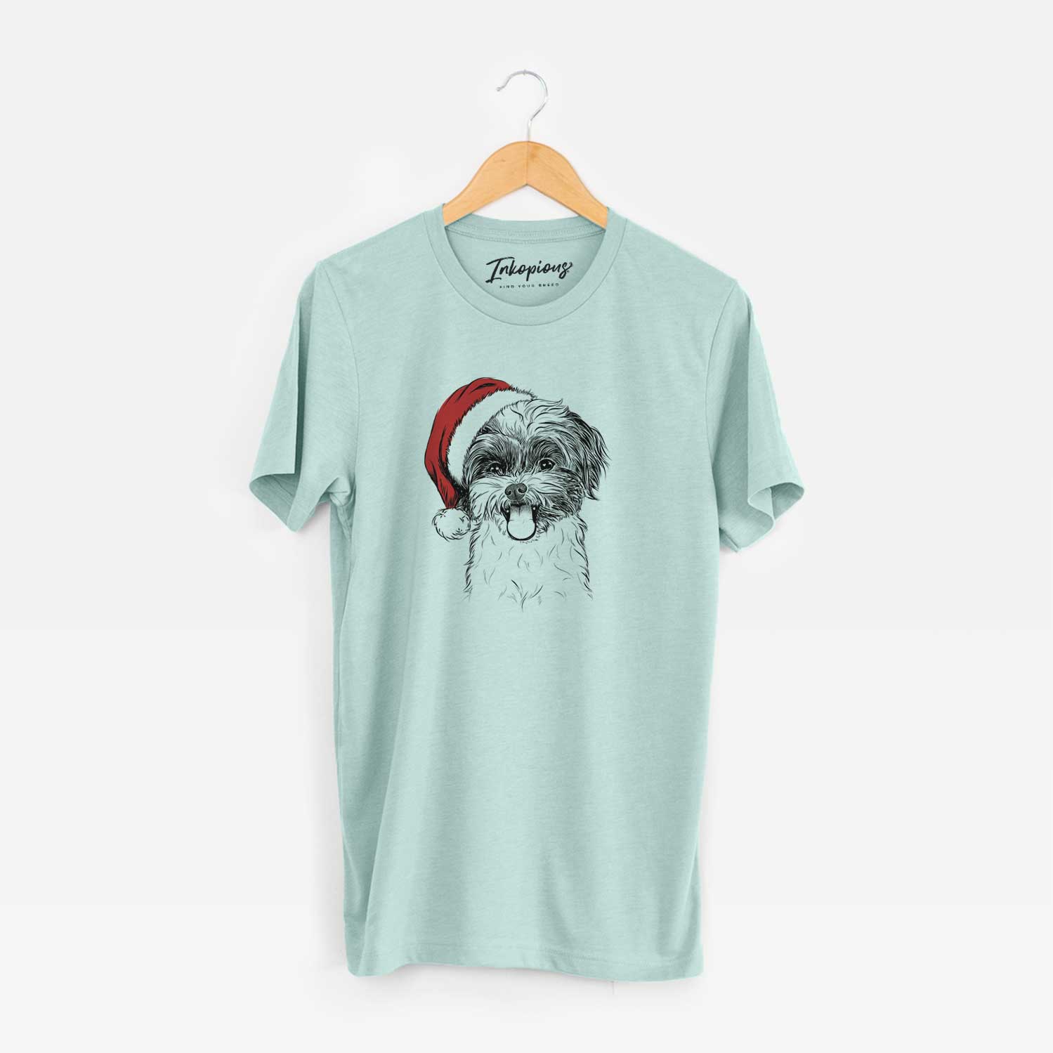 Hand-drawn sketch of Pepper the Shihpoo wearing a Santa hat on a Heather Sage Unisex crewneck