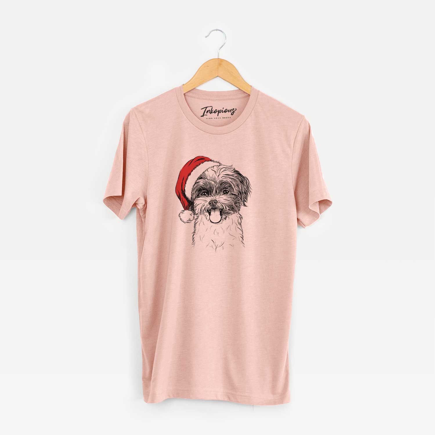 Hand-drawn sketch of Pepper the Shihpoo wearing a Santa hat on a Peach Unisex crewneck