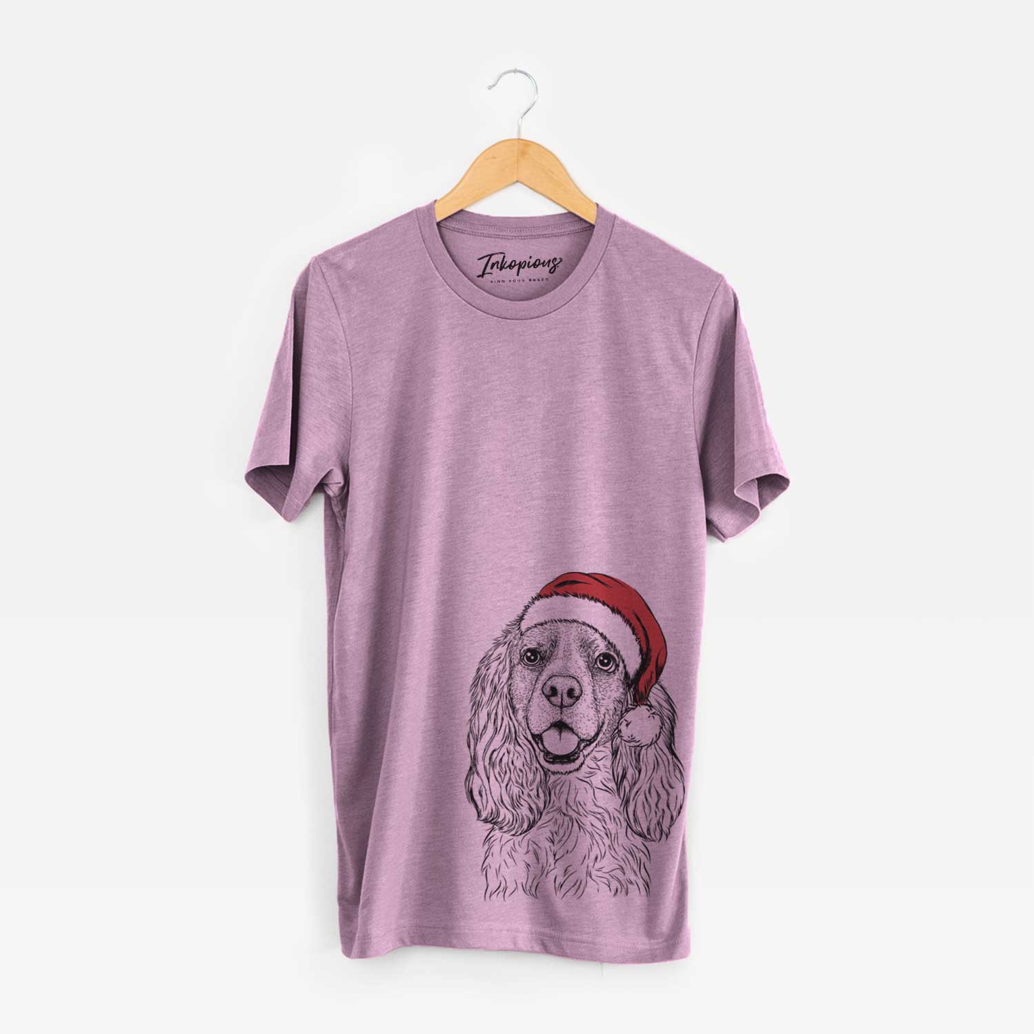 Hand-drawn sketch of Perry the Cockalier wearing a Santa hat on an Orchid Unisex crewneck