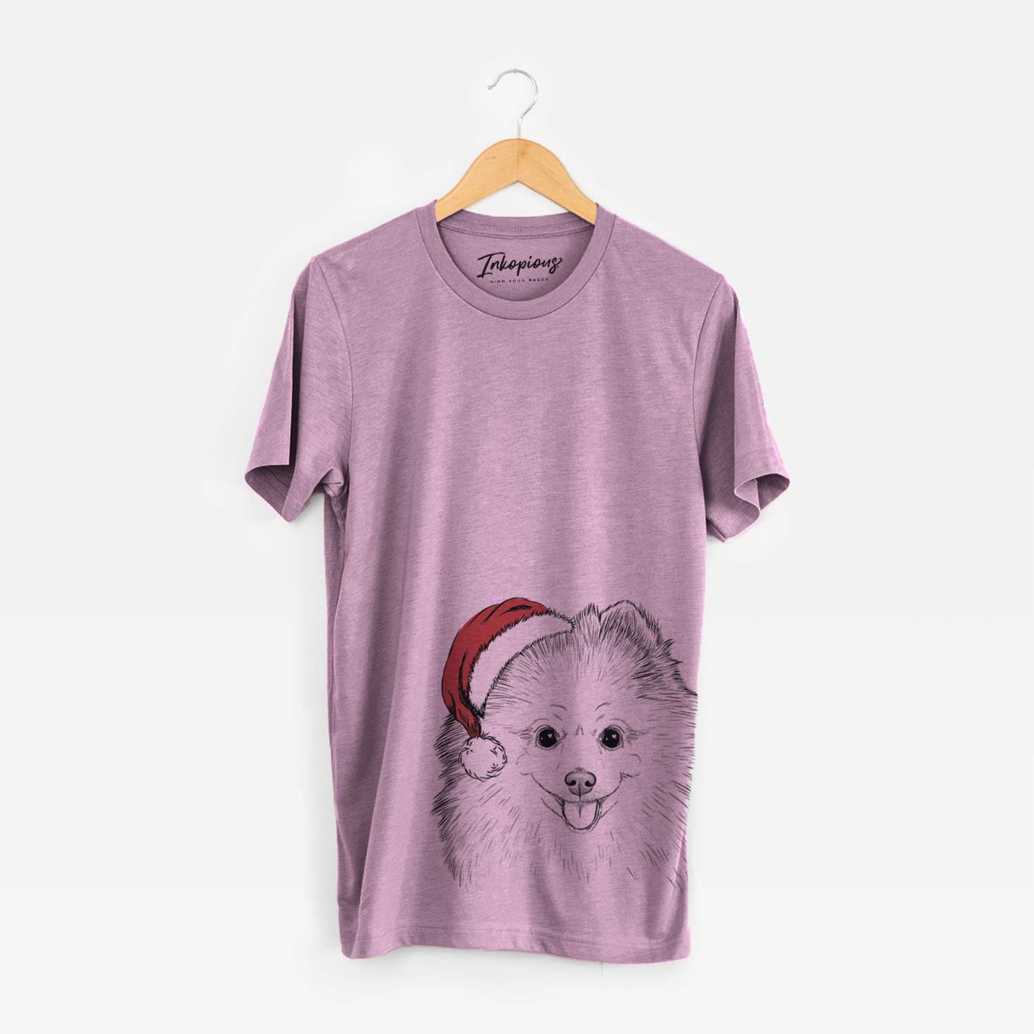 Hand-drawn sketch of Piper Jo the Pomeranian wearing a Santa hat on an Orchid Unisex crewneck