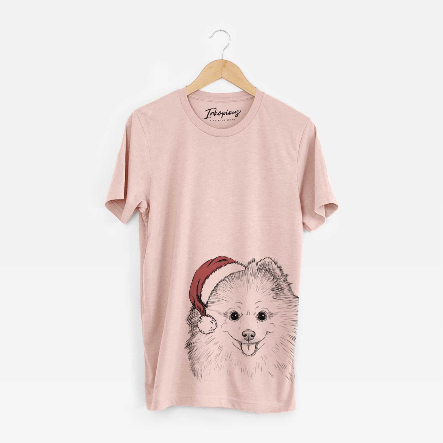 Hand-drawn sketch of Piper Jo the Pomeranian wearing a Santa hat on a Peach Unisex crewneck