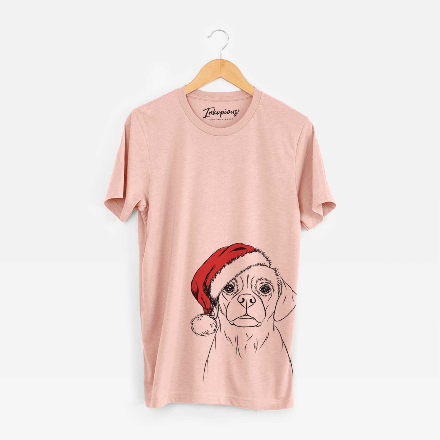 Hand-drawn sketch of Popcorn the Puggle wearing a Santa hat on a Peach Unisex crewneck