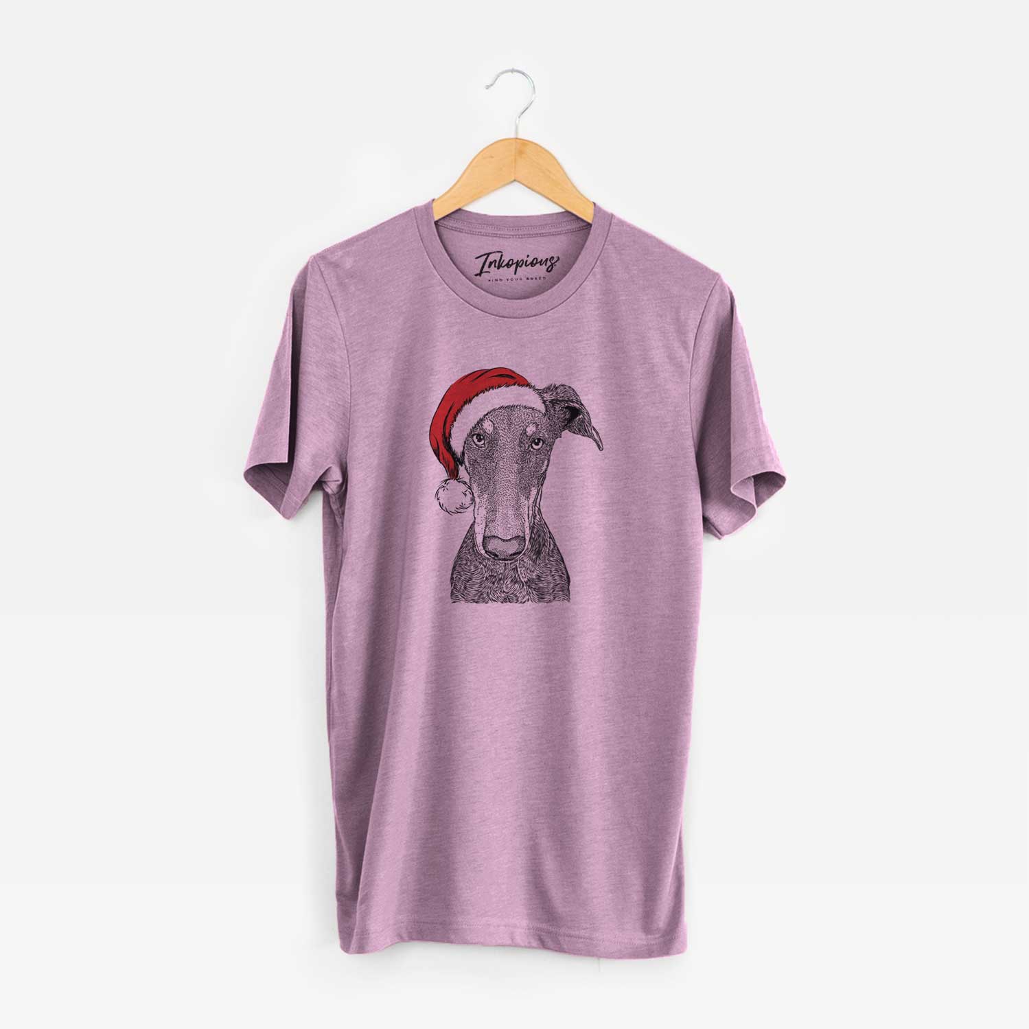 Hand-drawn sketch of Princess Fiona the Doberman Pinscher wearing a Santa hat on an Orchid Unisex crewneck