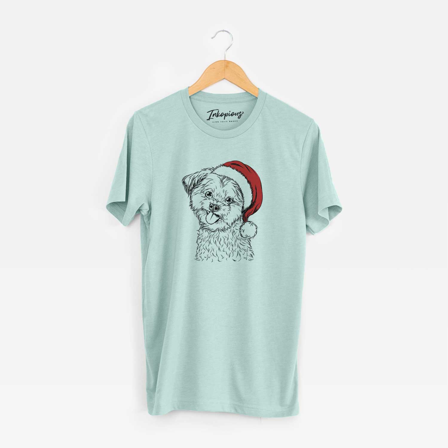 Hand-drawn sketch of Puff the Malshi wearing a Santa hat on a Heather Sage Unisex crewneck