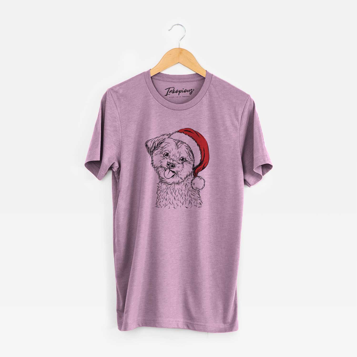 Hand-drawn sketch of Puff the Malshi wearing a Santa hat on an Orchid Unisex crewneck