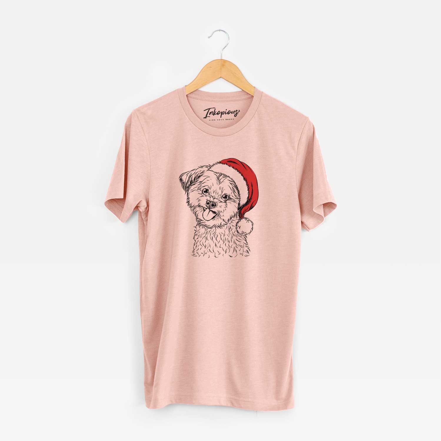 Hand-drawn sketch of Puff the Malshi wearing a Santa hat on a Peach Unisex crewneck