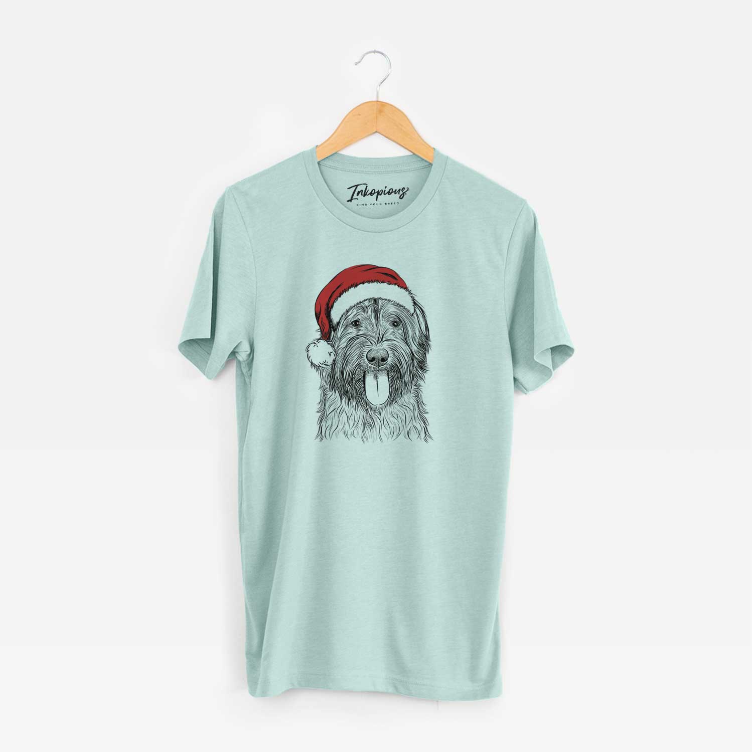 Hand-drawn sketch of Puig the Catalan Sheepdog wearing a Santa hat on a Heather Sage Unisex crewneck