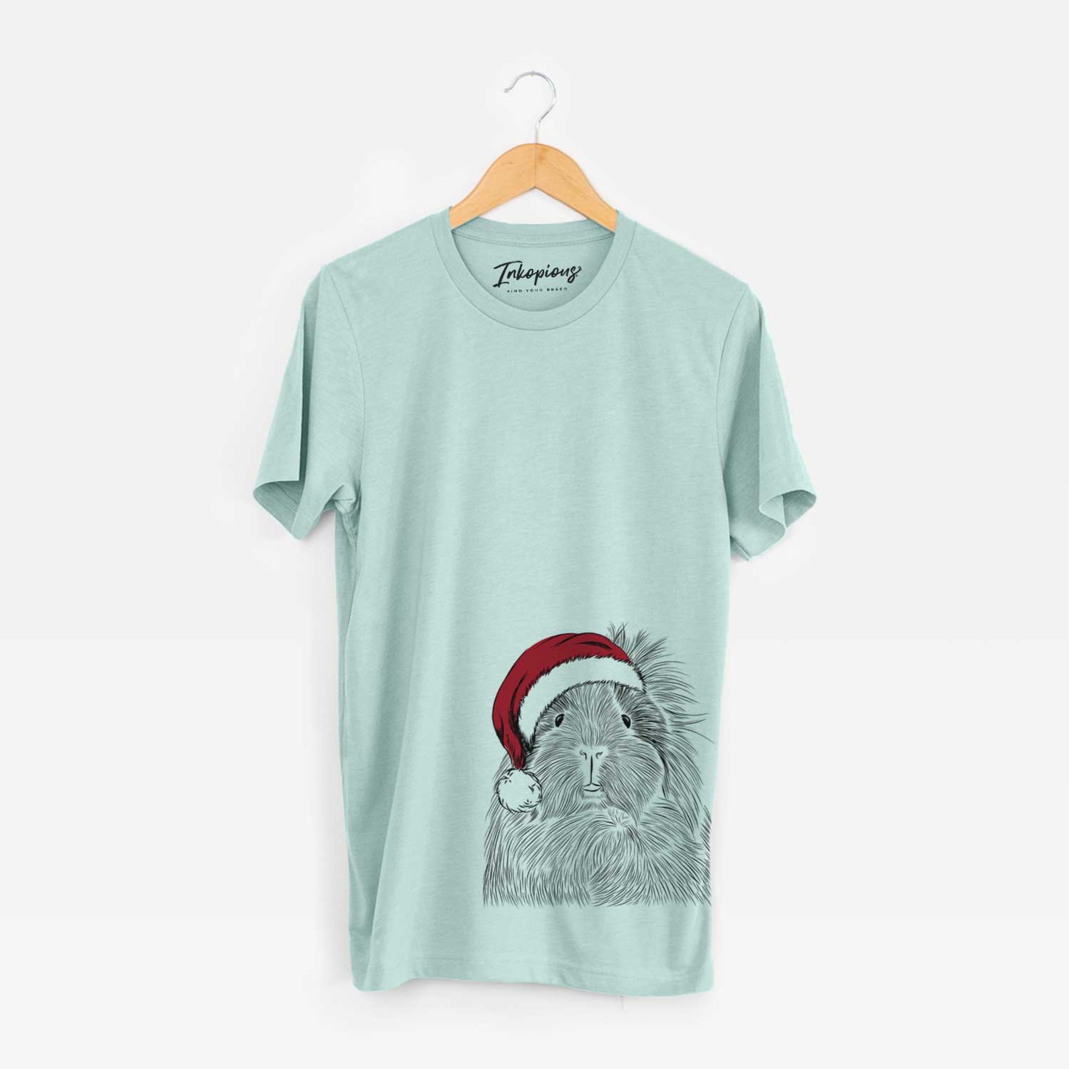 Hand-drawn sketch of Rhino the Guinea Pig wearing a Santa hat on a Heather Sage Unisex crewneck