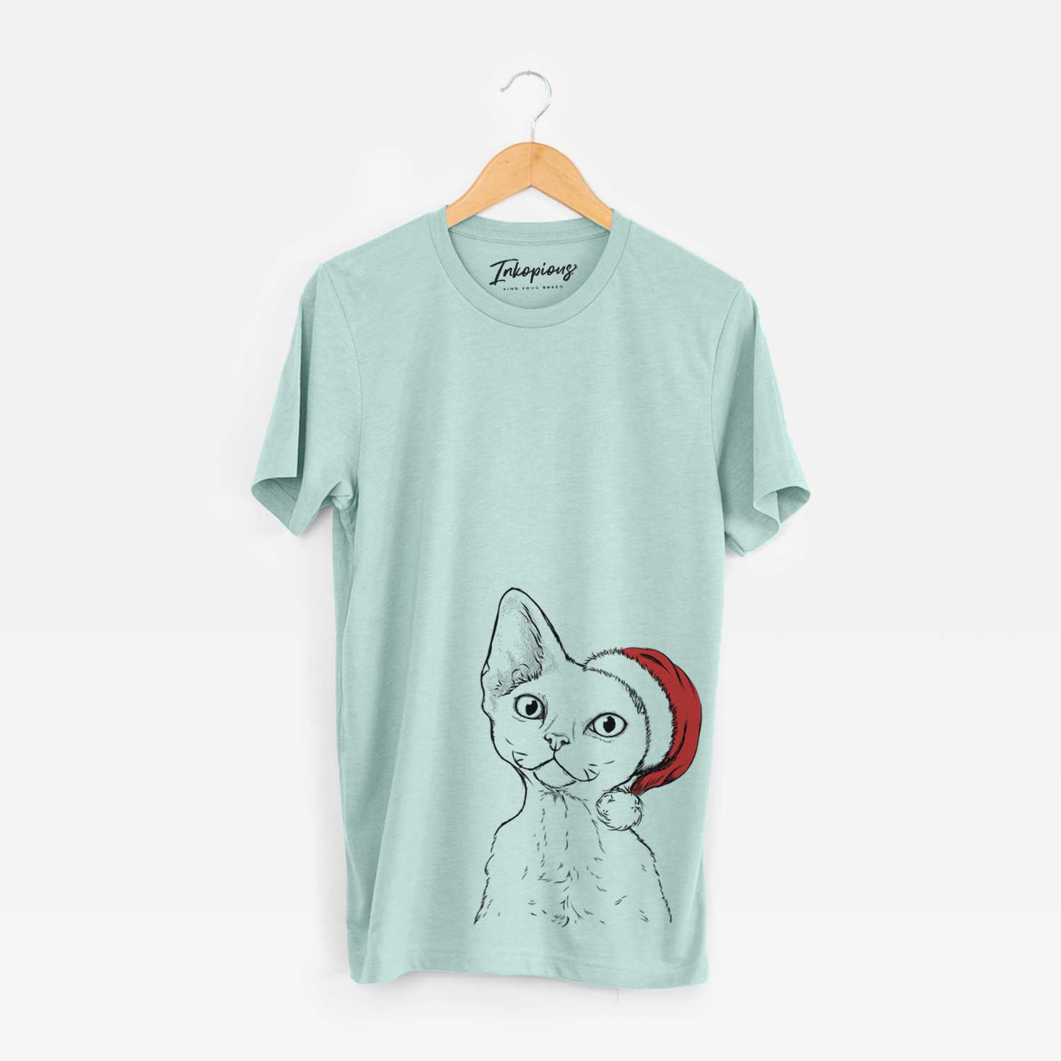 Hand-drawn sketch of Ripley the Devon Rex Cat wearing a Santa hat on a Heather Sage Unisex crewneck