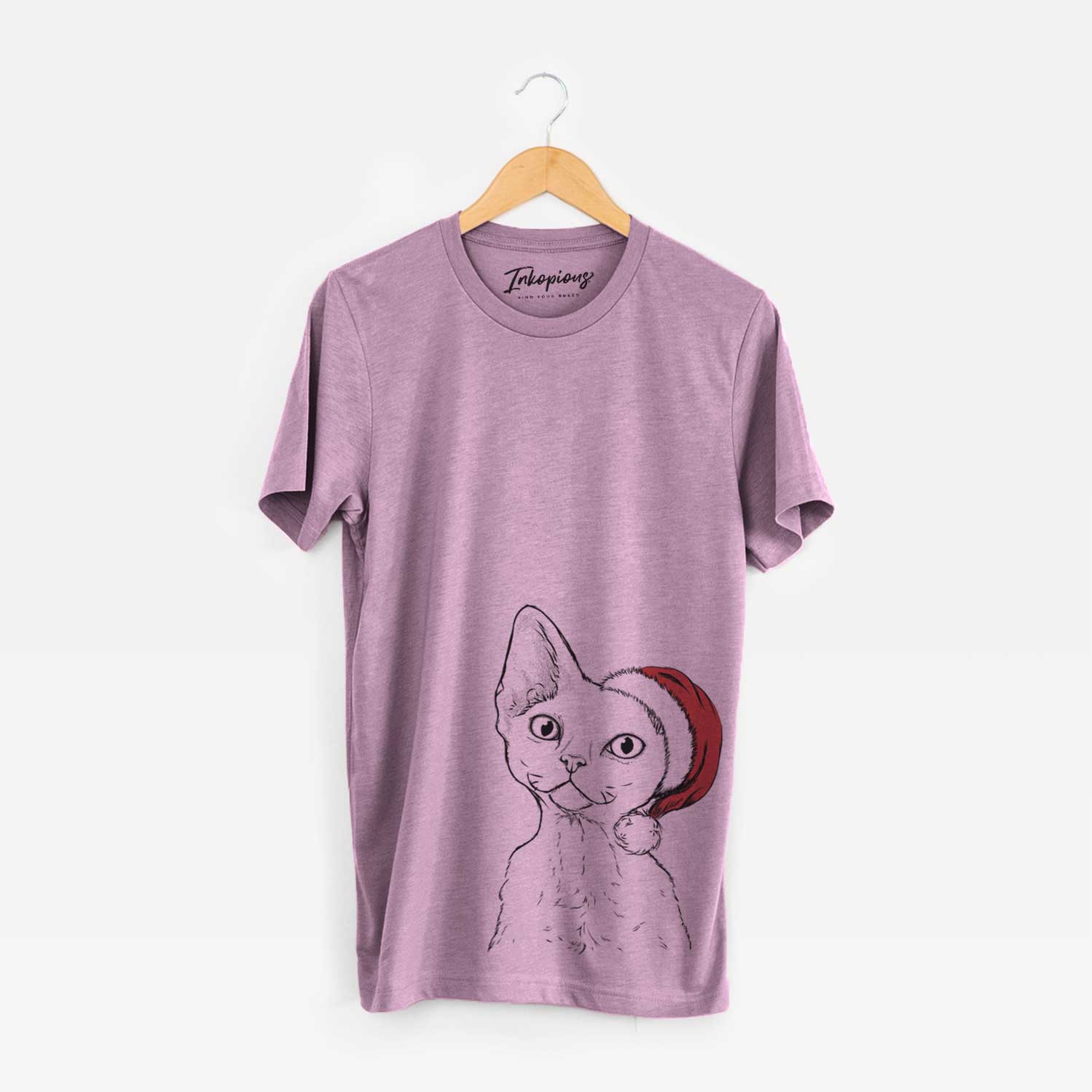 Hand-drawn sketch of Ripley the Devon Rex Cat wearing a Santa hat on an Orchid Unisex crewneck