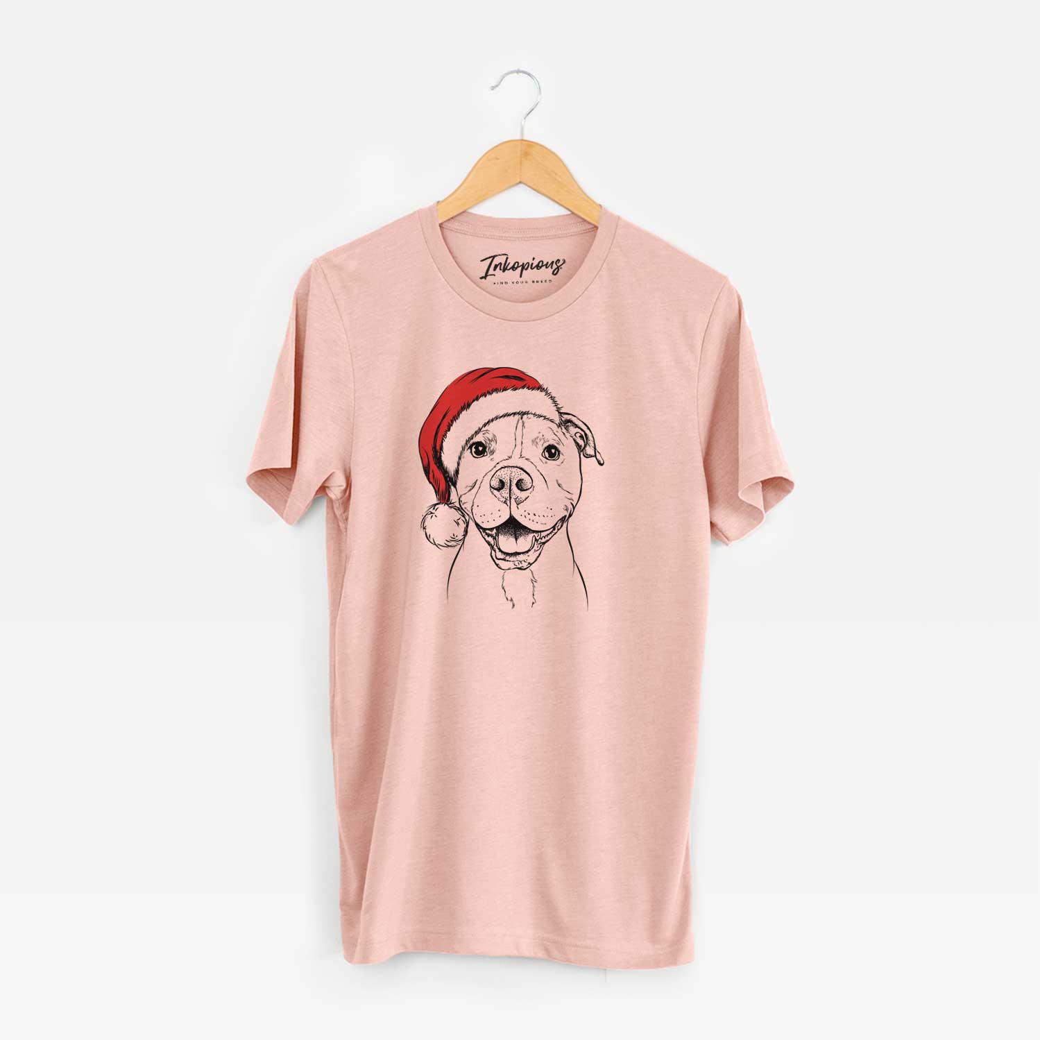 Hand-drawn sketch of Roscoe the Pitbull wearing a Santa hat on a Peach Unisex crewneck