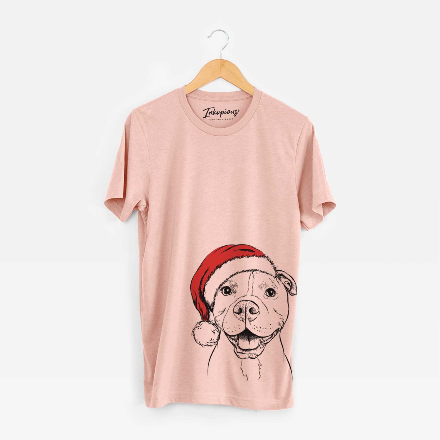 Hand-drawn sketch of Roscoe the Pitbull wearing a Santa hat on a Peach Unisex crewneck
