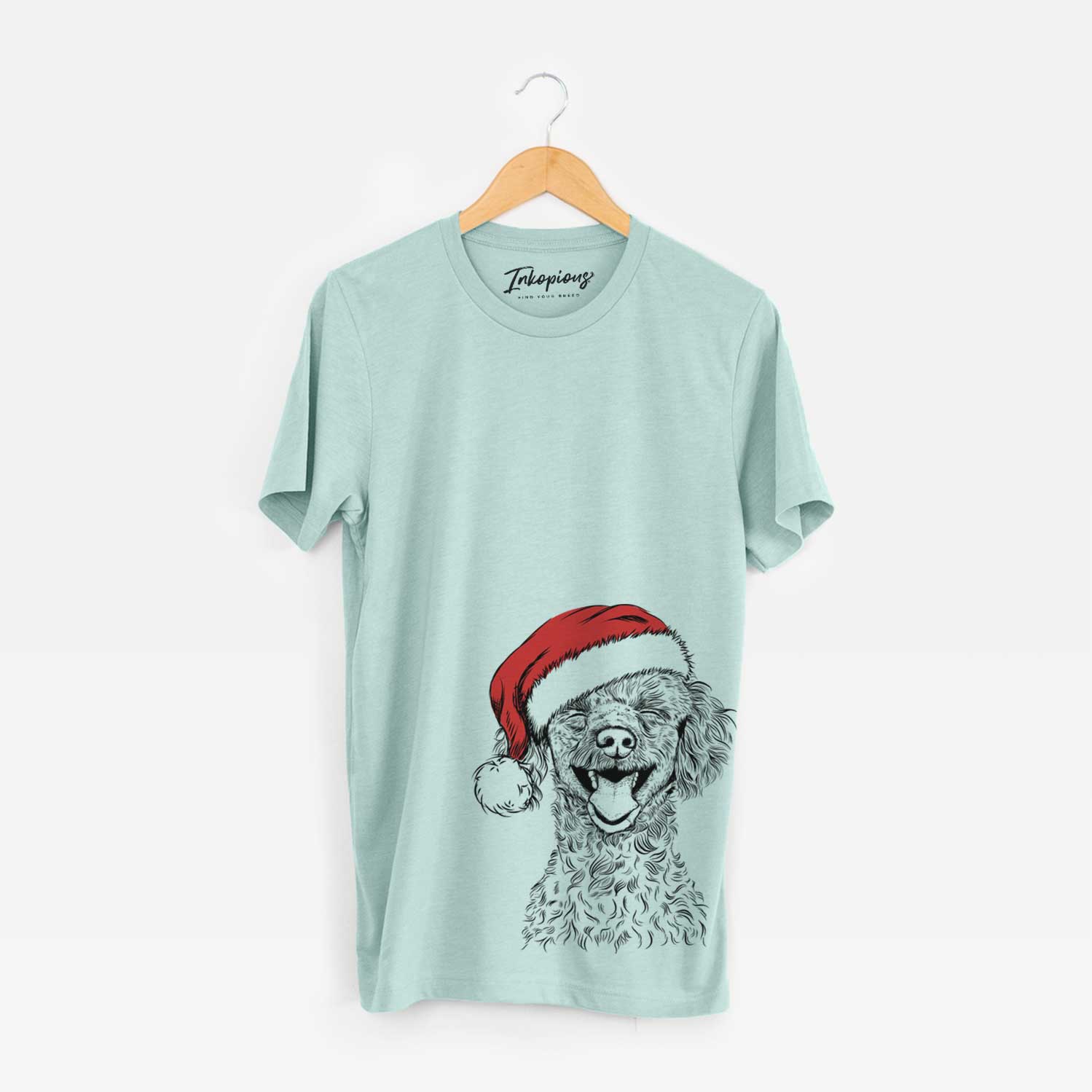 Hand-drawn sketch of Rusty the Toy Poodle wearing a Santa hat on a Heather Sage Unisex crewneck