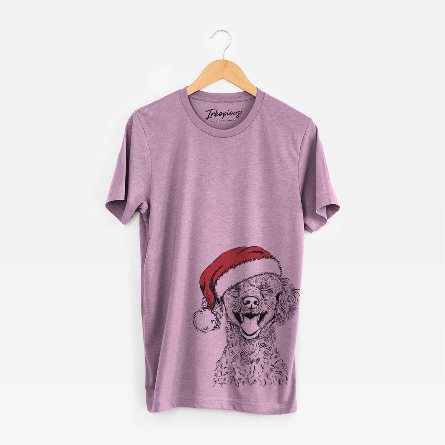 Hand-drawn sketch of Rusty the Toy Poodle wearing a Santa hat on an Orchid Unisex crewneck