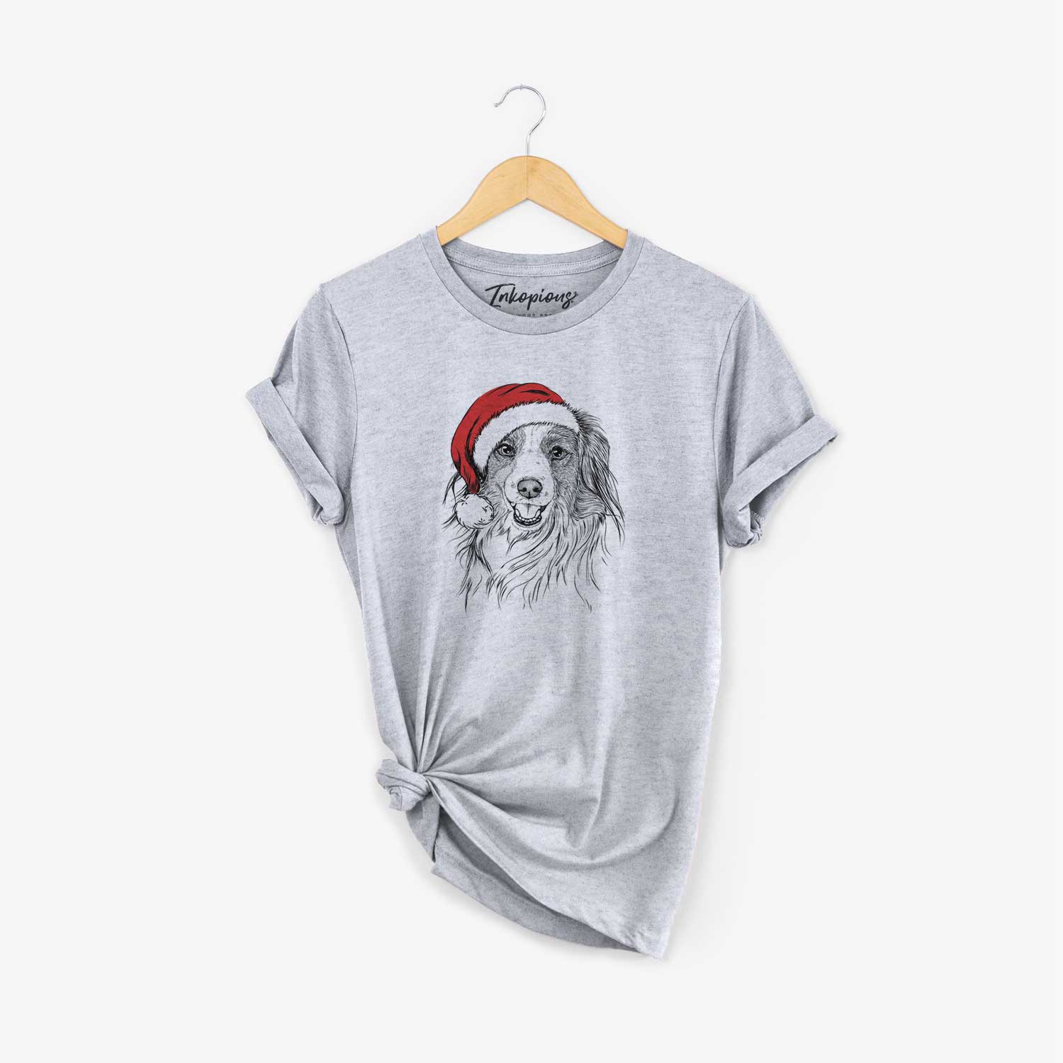Hand-drawn sketch of Rutger the Nederlandse Kooikerhondje wearing a Santa hat on a Grey Unisex crewneck