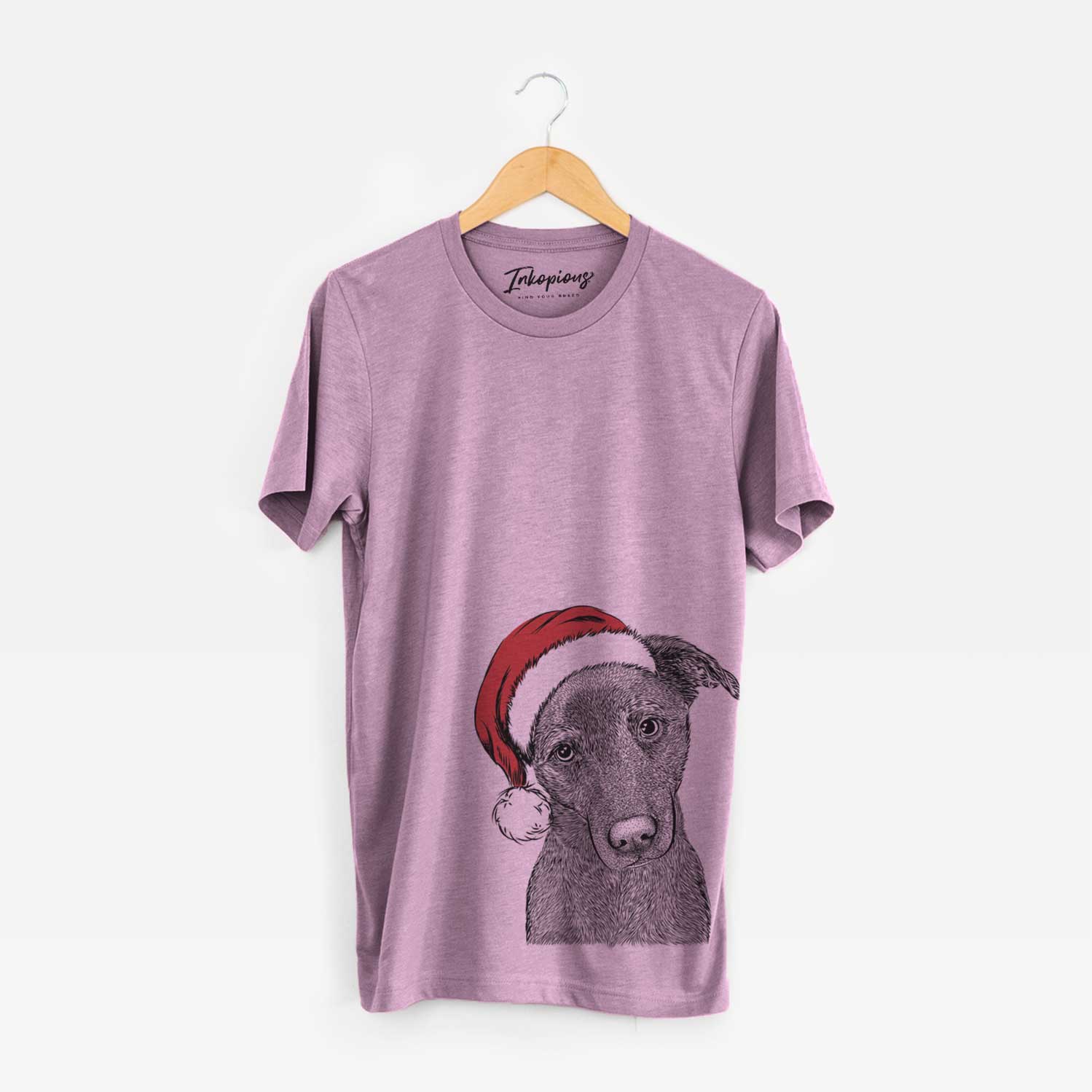 Hand-drawn sketch of Sadie the Whipador wearing a Santa hat on an Orchid Unisex crewneck