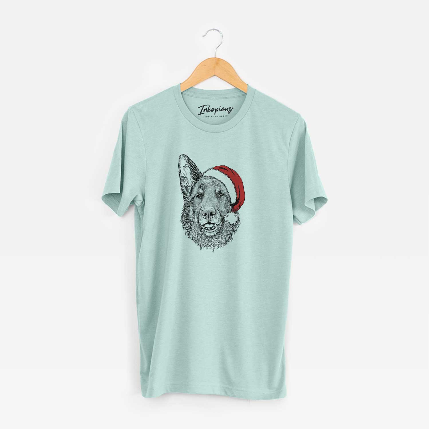 Hand-drawn sketch of Sammie the German Shepherd wearing a Santa hat on a Heather Sage Unisex crewneck