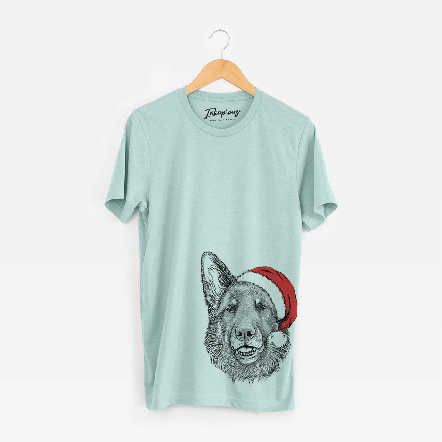Hand-drawn sketch of Sammie the German Shepherd wearing a Santa hat on a Heather Sage Unisex crewneck
