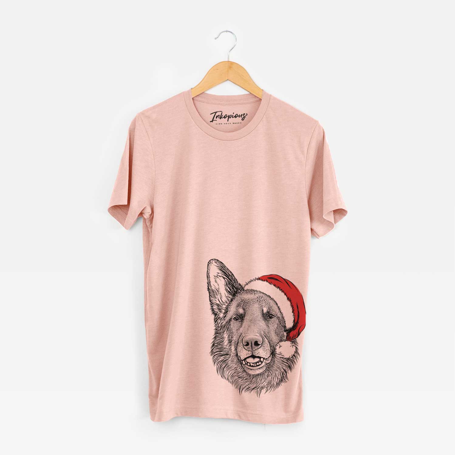 Hand-drawn sketch of Sammie the German Shepherd wearing a Santa hat on a Peach Unisex crewneck