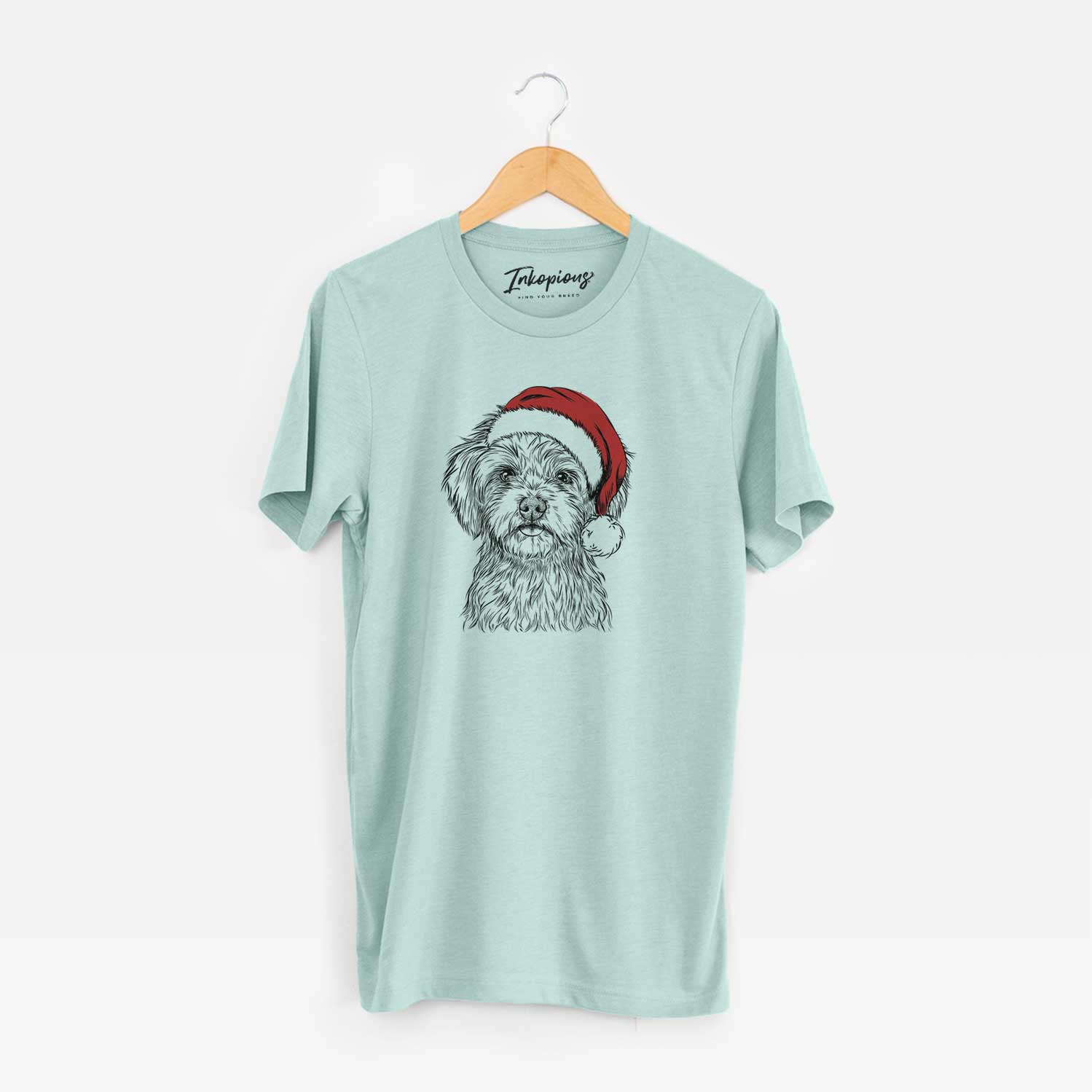 Hand-drawn sketch of Sammy the Shorkie wearing a Santa hat on a Heather Sage Unisex crewneck