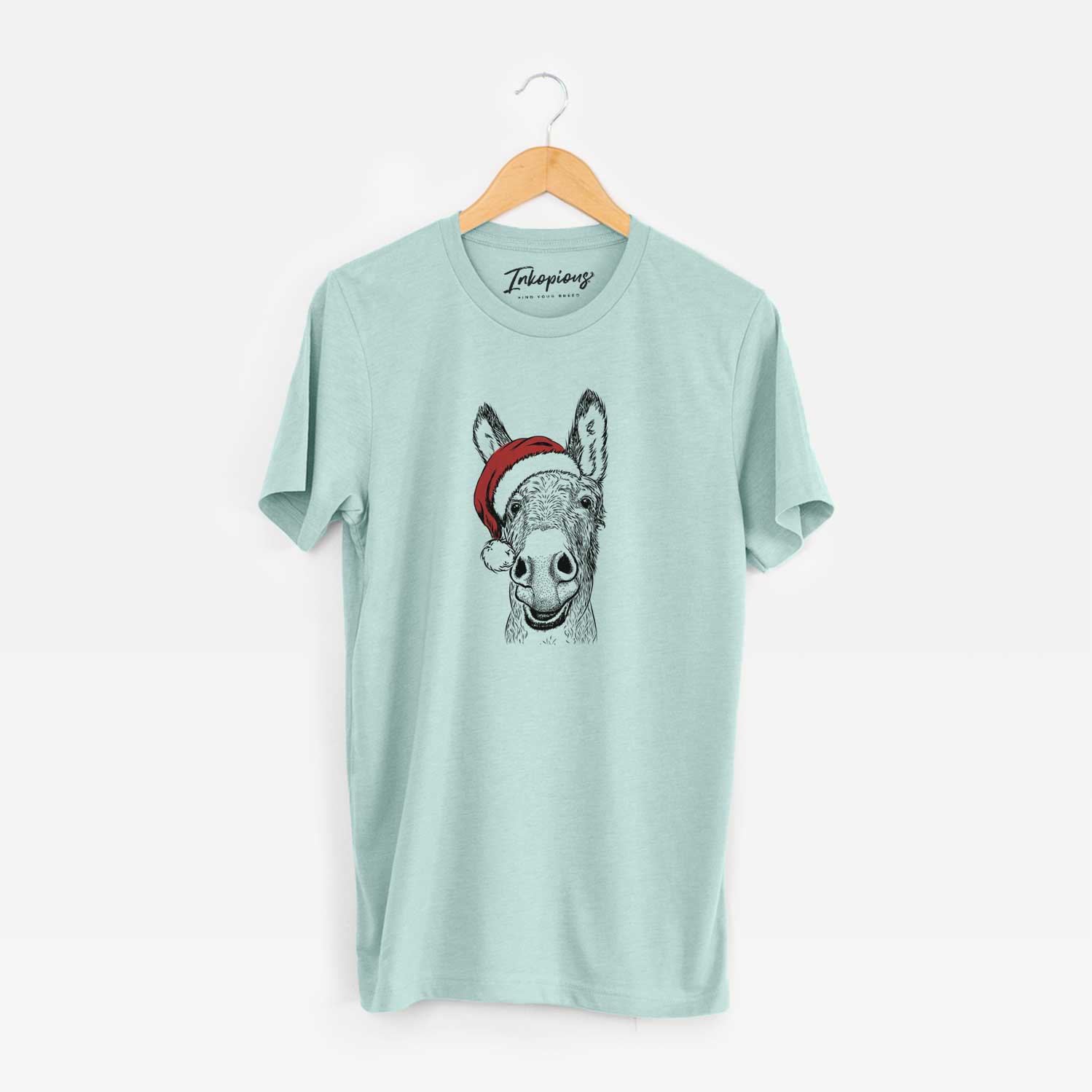 Hand-drawn sketch of Samule the Donkey wearing a Santa hat on a Heather Sage Unisex crewneck