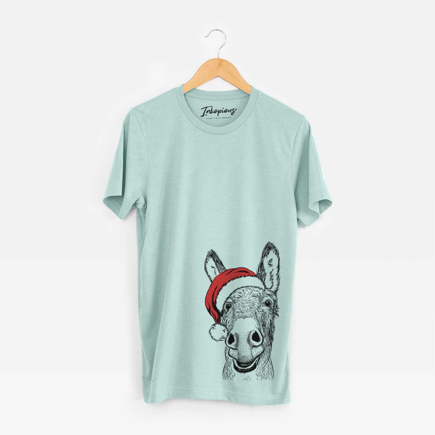 Hand-drawn sketch of Samule the Donkey wearing a Santa hat on a Heather Sage Unisex crewneck