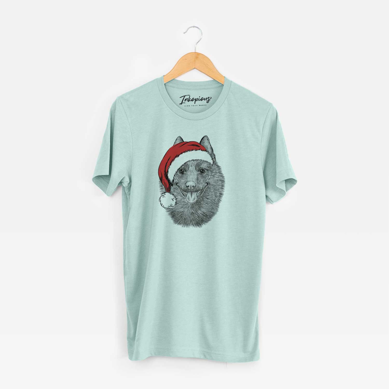 Hand-drawn sketch of Sander the Schipperke wearing a Santa hat on a Heather Sage Unisex crewneck