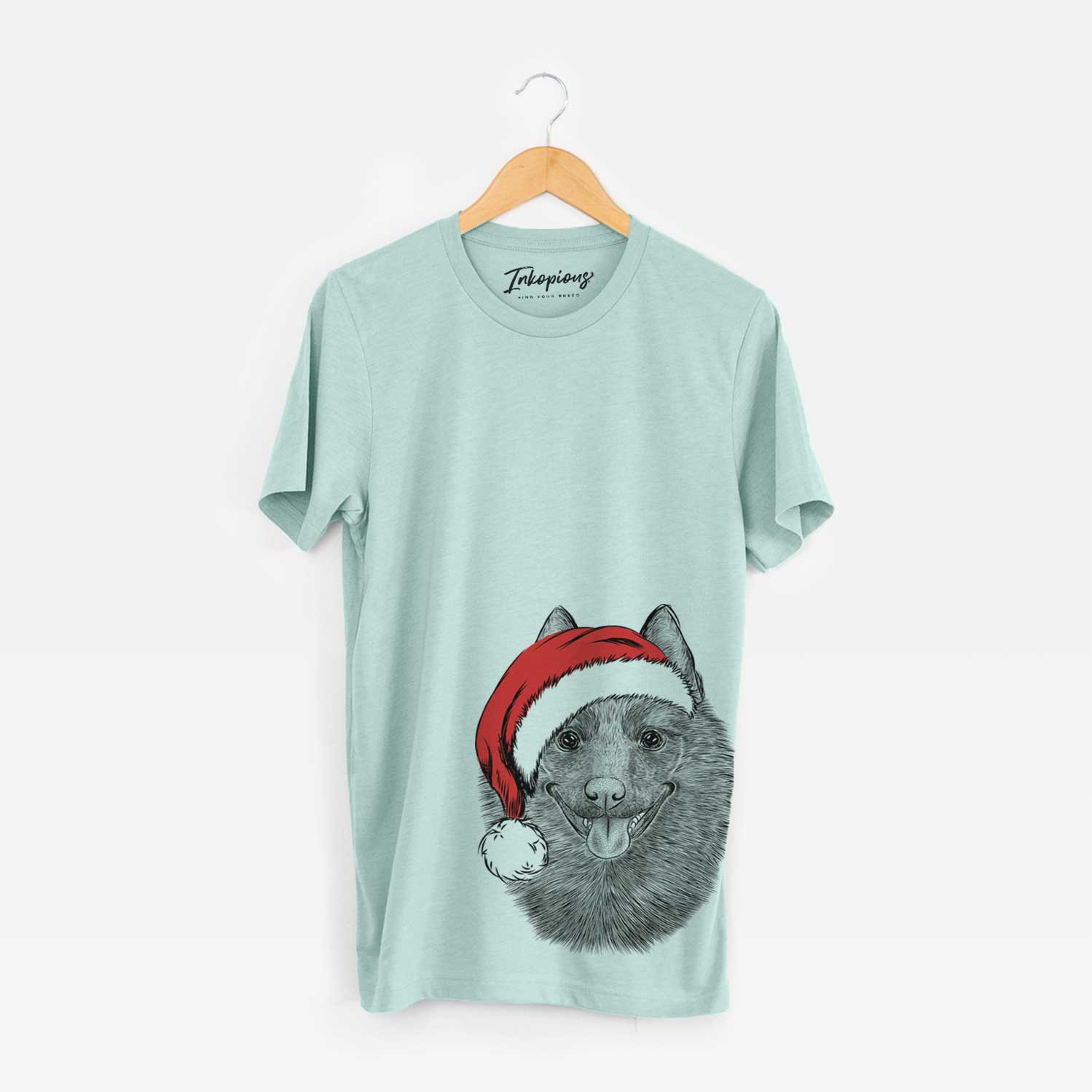 Hand-drawn sketch of Sander the Schipperke wearing a Santa hat on a Heather Sage Unisex crewneck