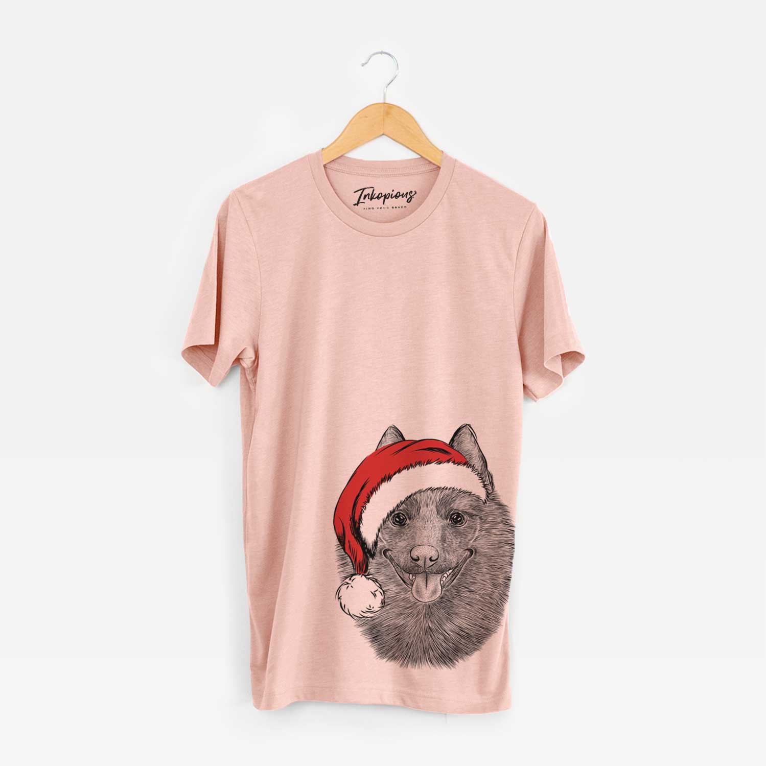 Hand-drawn sketch of Sander the Schipperke wearing a Santa hat on a Peach Unisex crewneck