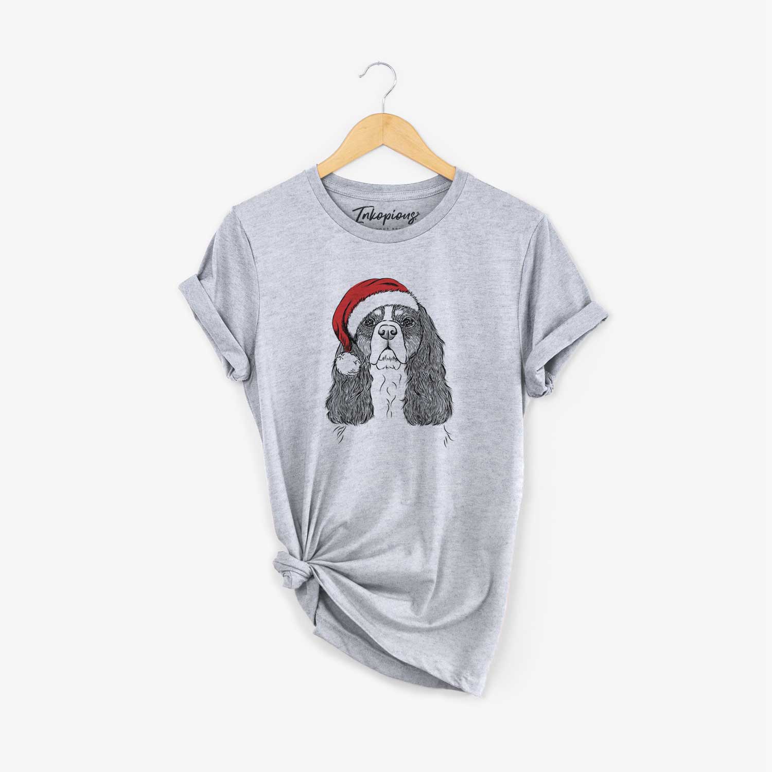 Hand-drawn sketch of Sebastian the Cavalier King Charles Spaniel wearing a Santa hat on a Grey Unisex crewneck