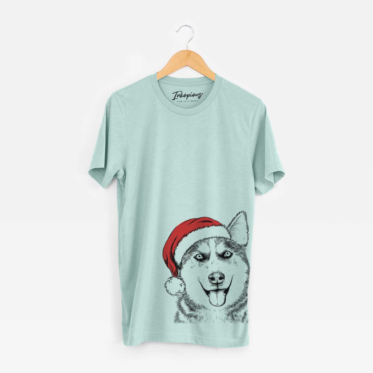 Hand-drawn sketch of Sesi the Siberian Husky wearing a Santa hat on a Heather Sage Unisex crewneck