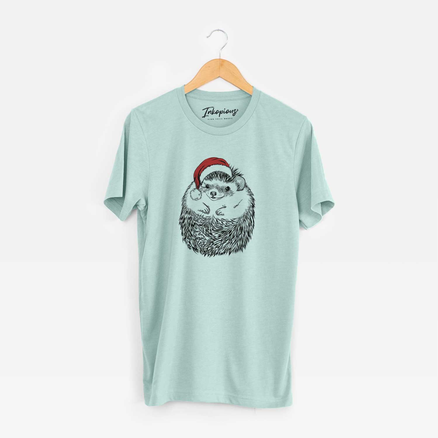 Hand-drawn sketch of Sid the Hedgehog wearing a Santa hat on a Heather Sage Unisex crewneck