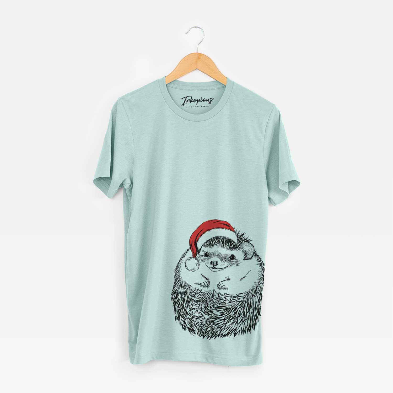 Hand-drawn sketch of Sid the Hedgehog wearing a Santa hat on a Heather Sage Unisex crewneck