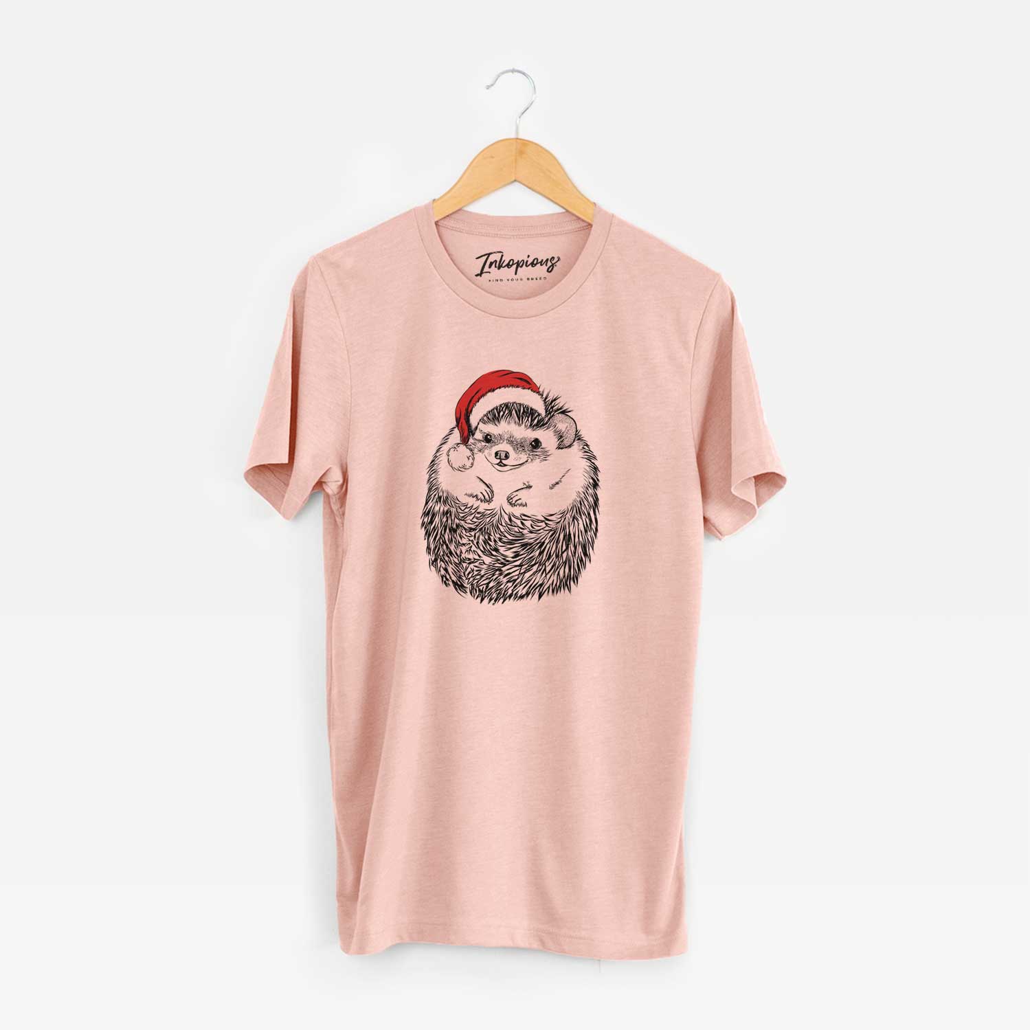 Hand-drawn sketch of Sid the Hedgehog wearing a Santa hat on a Peach Unisex crewneck
