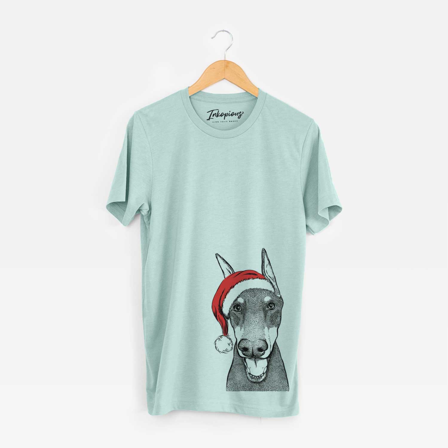 Hand-drawn sketch of Sir Duke the Doberman Pinscher wearing a Santa hat on a Heather Sage Unisex crewneck